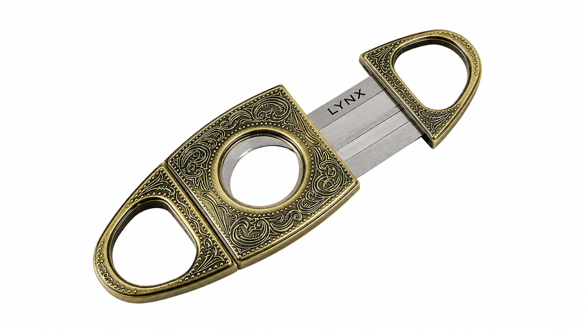 Decorative cigar cutter with 'LYNX' branding on a white background