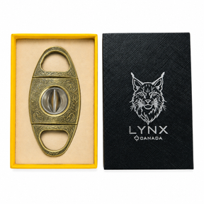 Cigar cutter in a yellow box with a black cover featuring a lynx logo.
