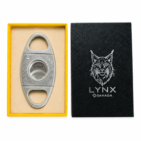 Cigar cutter with 'LYNX' branding in a yellow box and black case on a white background