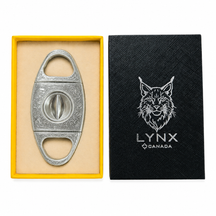 Cigar cutter in a yellow box with a black card featuring a lynx logo on a white background